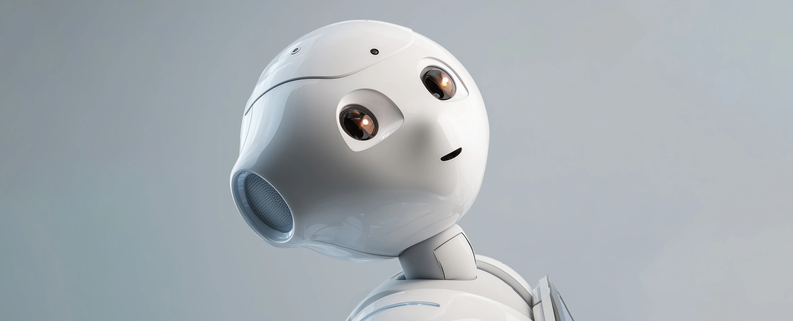 Close-up of a glossy white humanoid robot head tilted upward against a neutral gray background, looking curious.