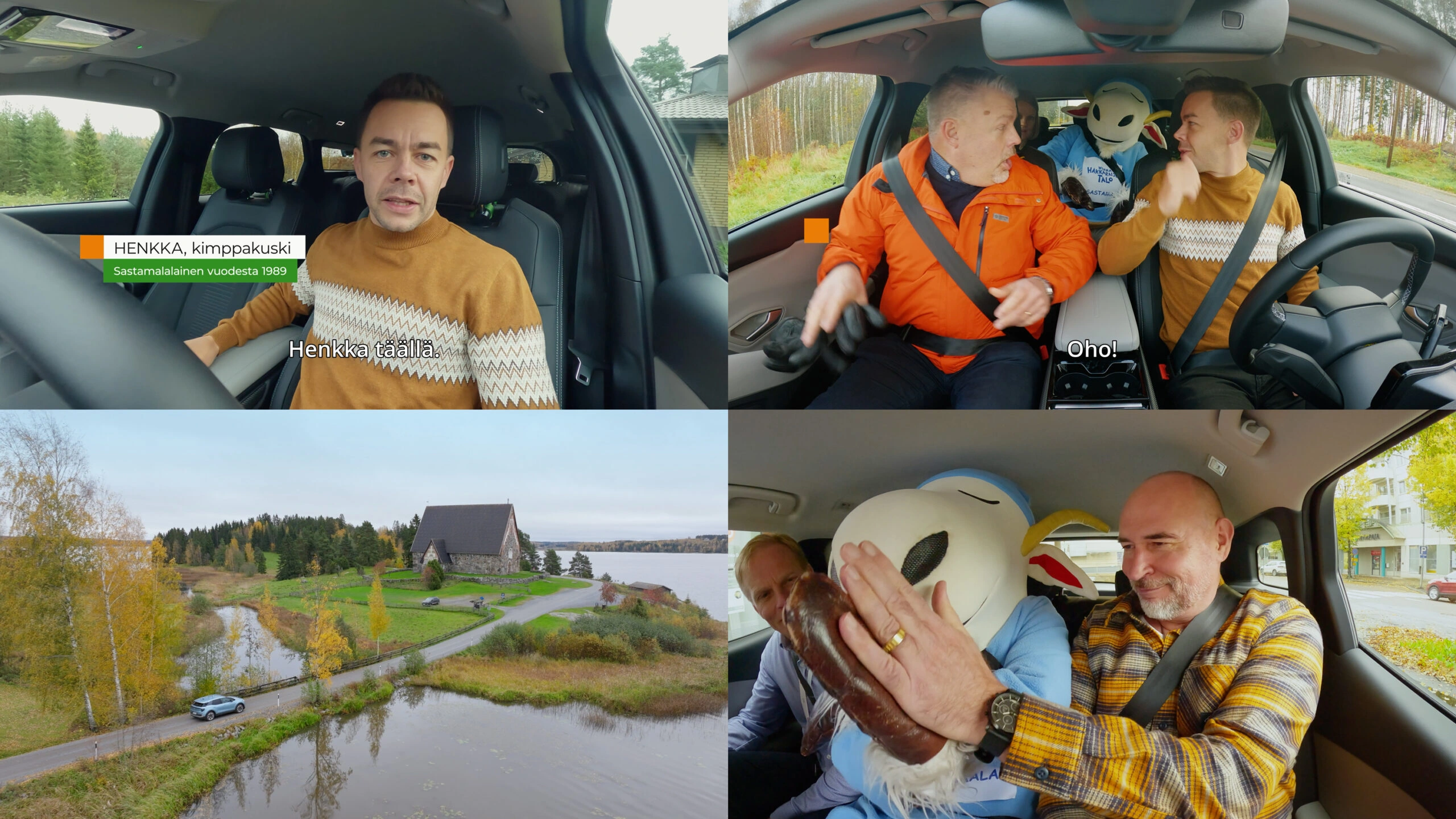 Man in a mustard sweater drives a car, looking at the camera with trees outside the window in the background (interior of a car).